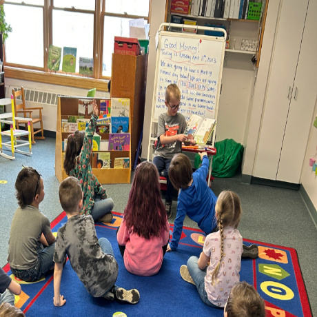 Featured image of article: First Grader, Brody, reading to Kindergarten!
